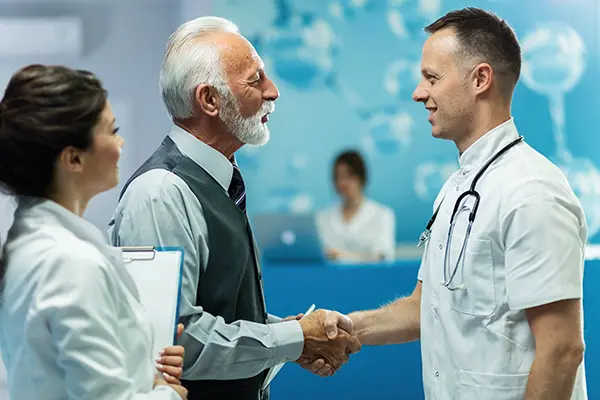 Doctor shaking hands with patient