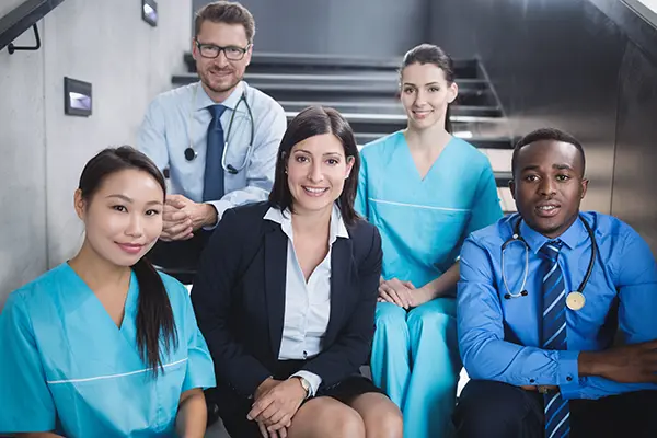 Doctors nurses sitting staircase